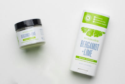 A jar and stick of schmidt's bergamot and lime deodorant